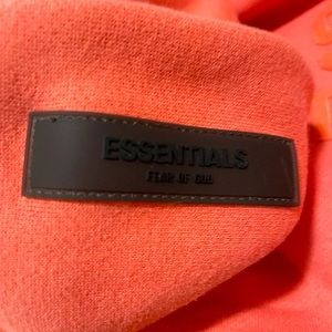 Selling essentials coral pink hoodie ss22 collection only work once